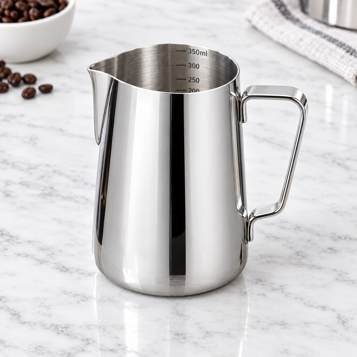 Shiny silver 350ml stainless steel milk frothing jug with measurement markings